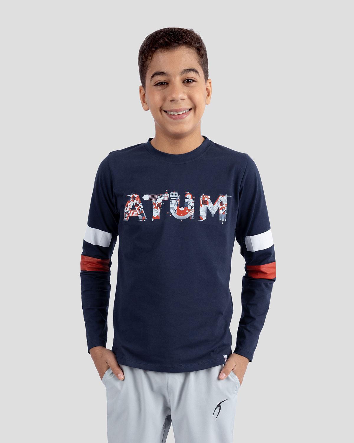Photo by ð—”ð—§ð—¨ð— SPORTSWEAR Â® on December 20, 2022. May be an image of 1 boy wears a navy T-shirt with atum logo.