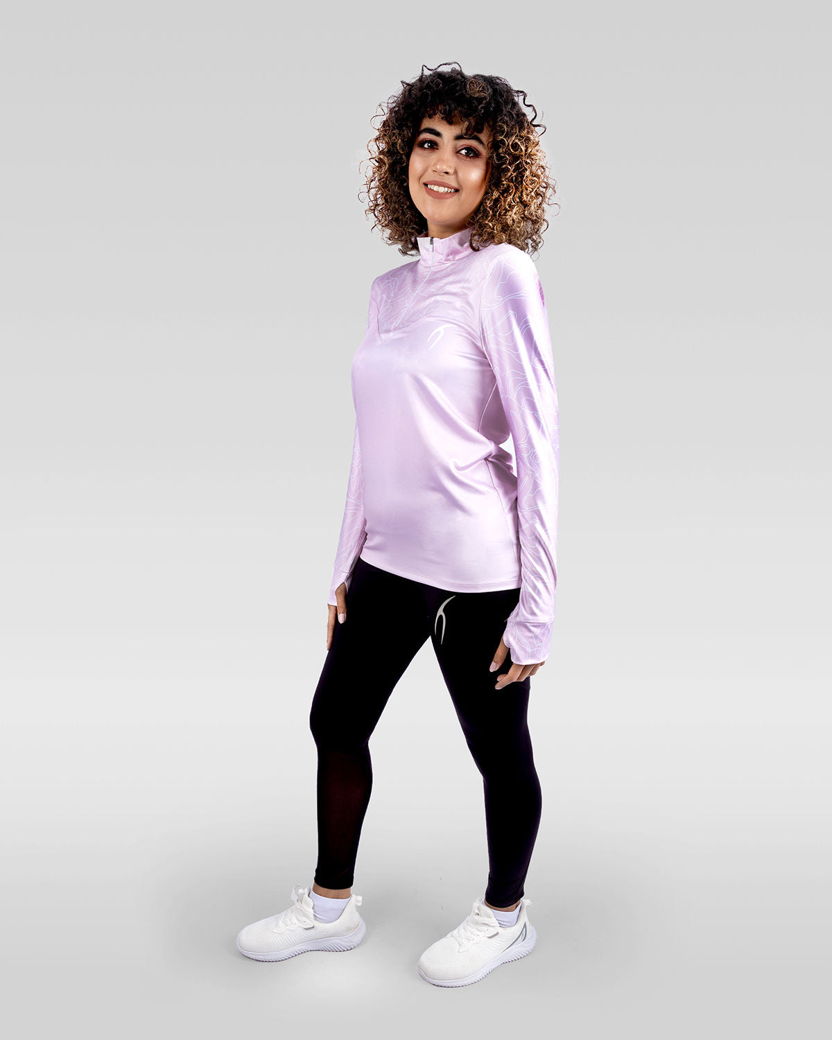 Photo by ð—”ð—§ð—¨ð— SPORTSWEAR Â® on December 20, 2022. May be an image of 1 woman wears rose training t-shirt, black leggings ,and white shoes.