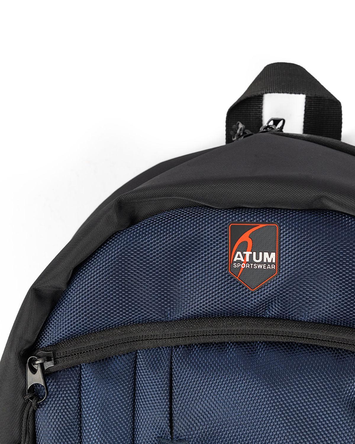 Photo by 𝗔𝗧𝗨𝗠 SPORTSWEAR ® on December 26, 2022. May be a navy premium backpack with atum logo.