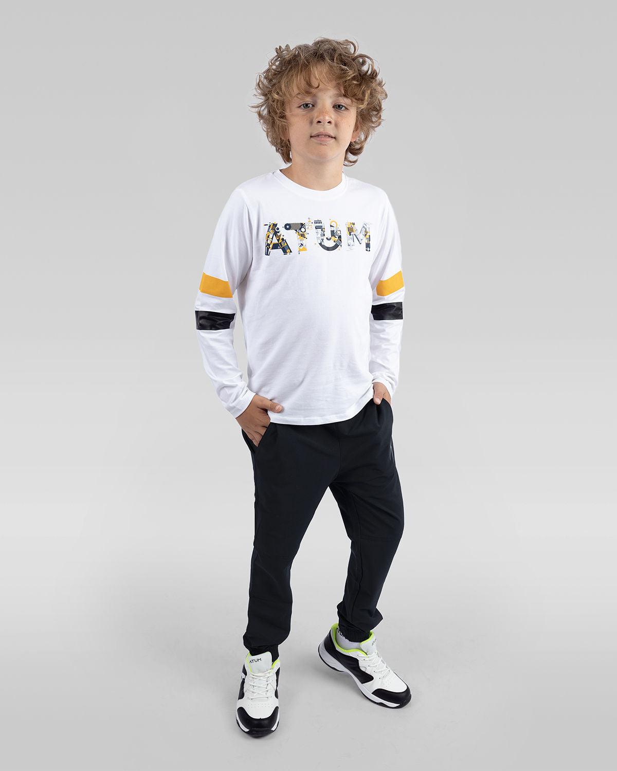 Photo by ð—”ð—§ð—¨ð— SPORTSWEAR Â® on December 20, 2022. May be an image of 1 boy wears a white T-shirt, black sweatpants and a white shoes with atum logo.