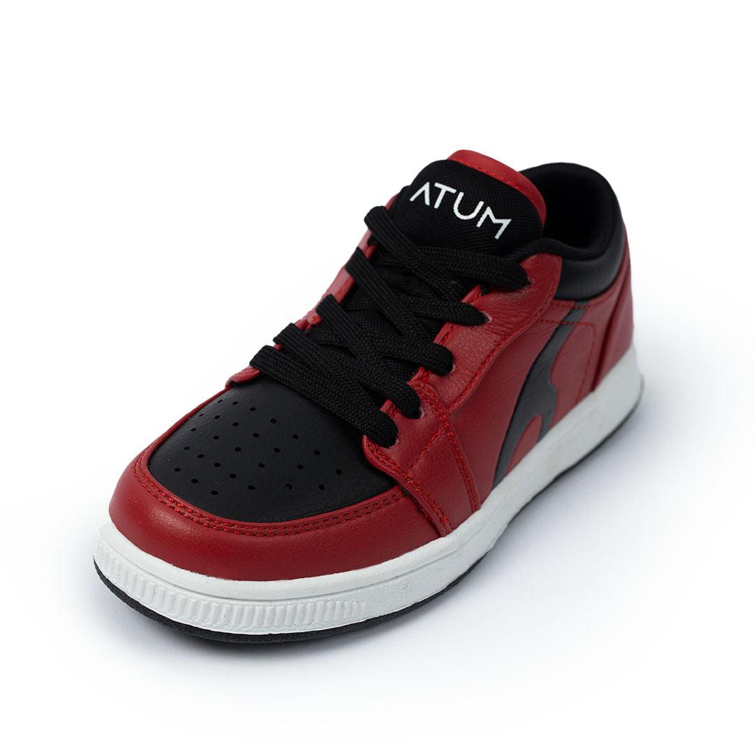 Photo by 𝗔𝗧𝗨𝗠 SPORTSWEAR ® on December 26, 2022. May be of red/black lifestyle shoes with atum logo