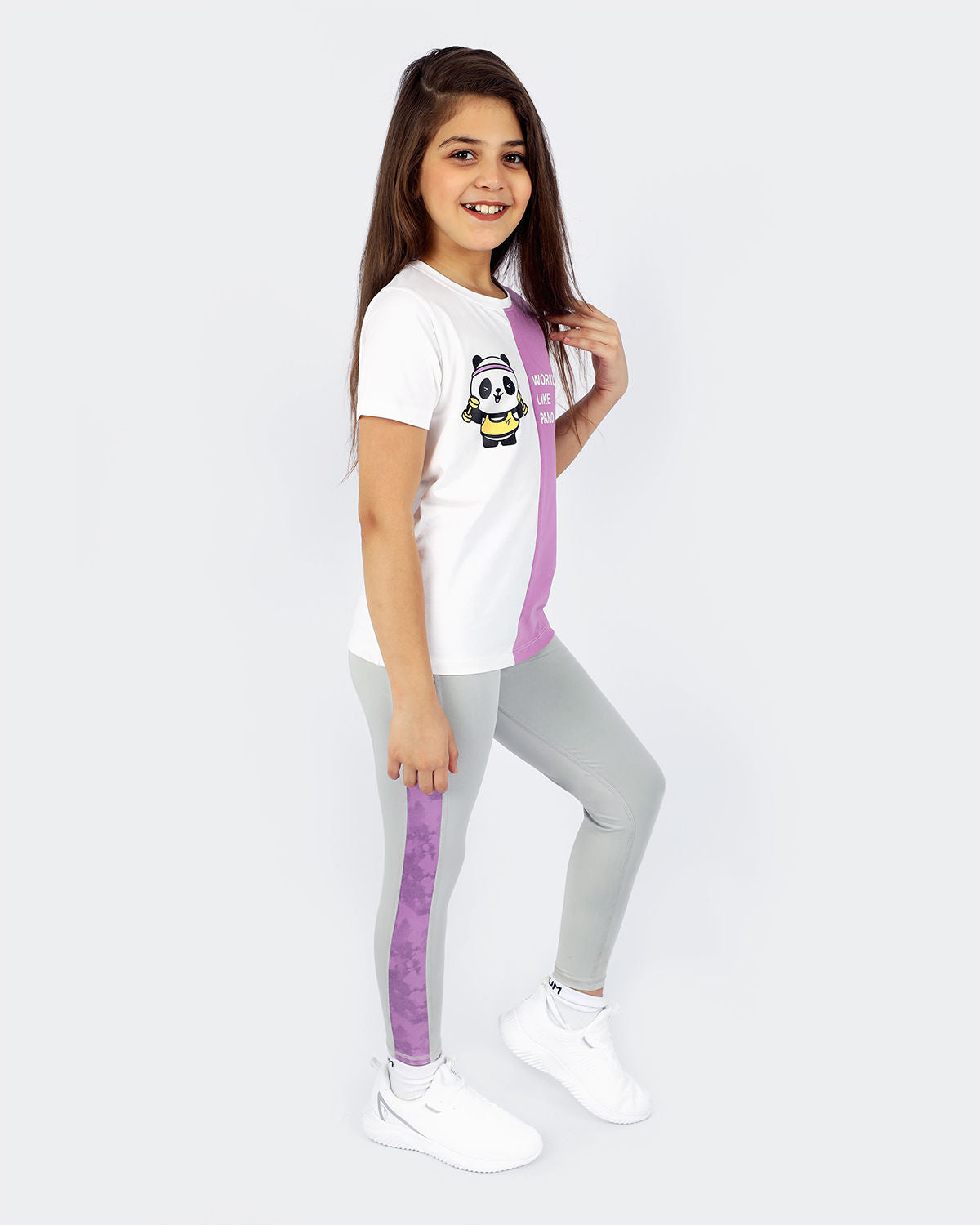 Photo by 𝗔𝗧𝗨𝗠 SPORTSWEAR ® on December 20, 2022. May be an image of 1 girl wears panda violet/white t-shirt, gray marble leggings and white shoes.