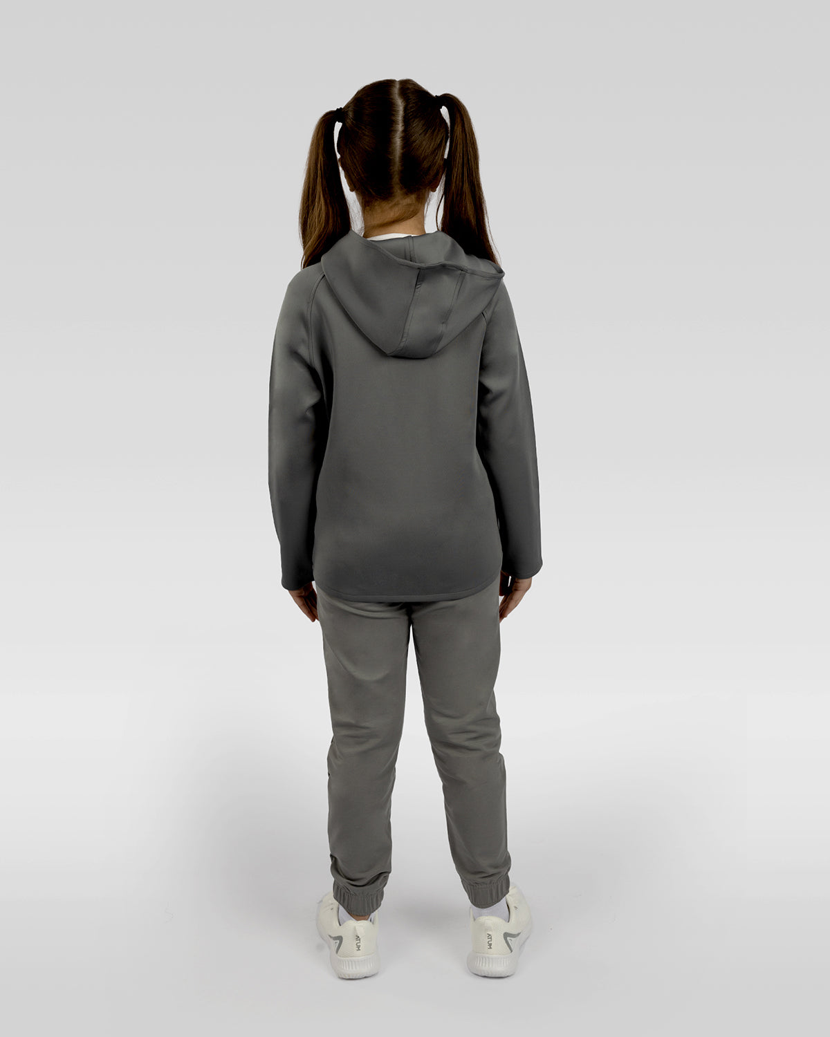 Photo by 𝗔𝗧𝗨𝗠 SPORTSWEAR ® on December 20, 2022. May be an image of 1 girl wears gray sweatpants, gray jacket and white shoes.