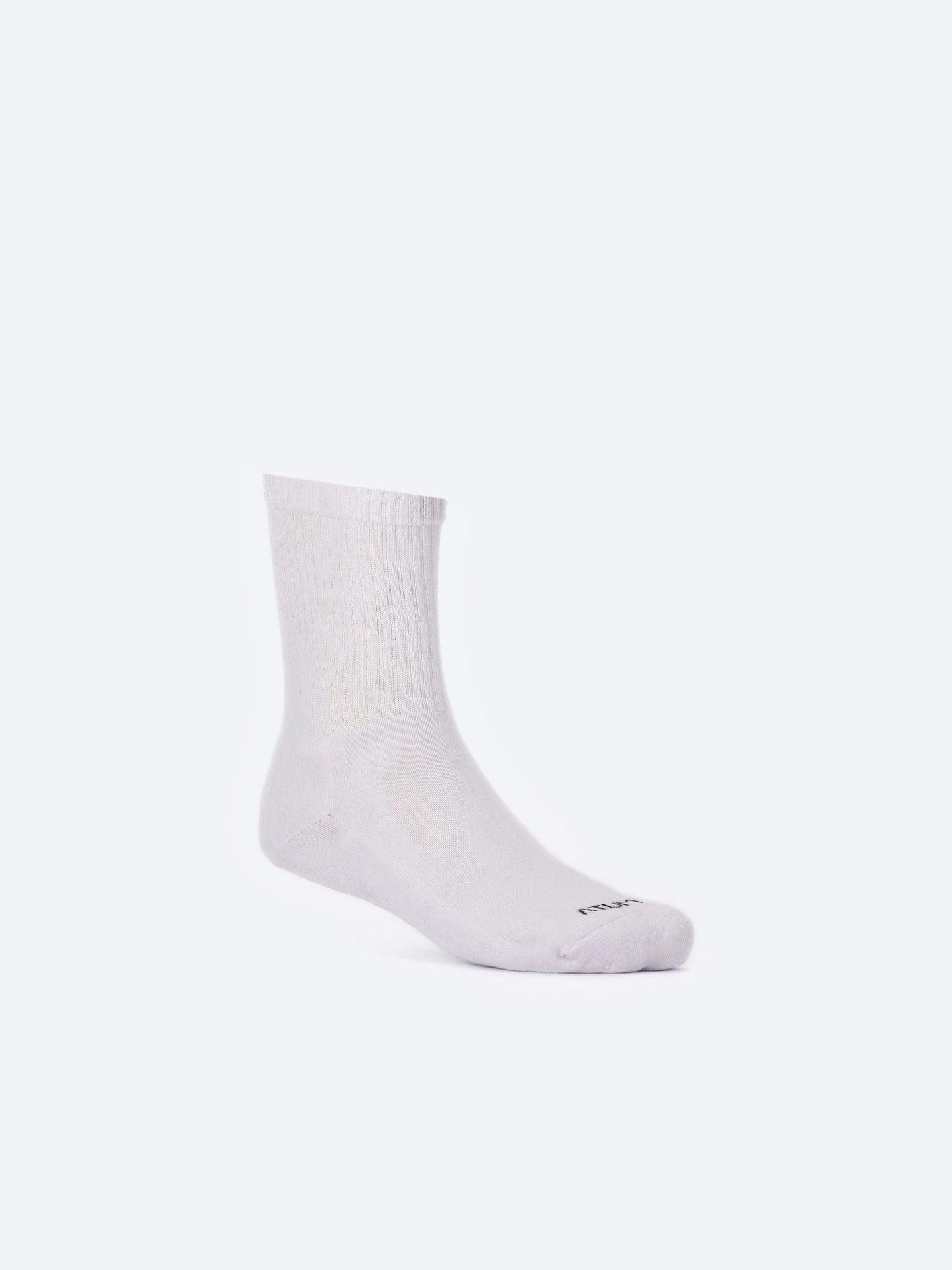 Photo by ð—”ð—§ð—¨ð— SPORTSWEAR Â® on December 26, 2022. May be kid's white mid-crew training socks with atum logo