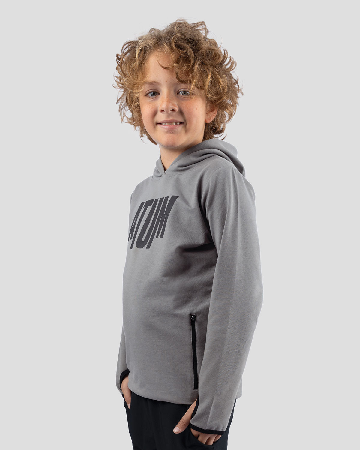 Photo by ð—”ð—§ð—¨ð— SPORTSWEAR Â® on December 20, 2022. May be an image of 1 boy wears a gray sweatshirt and a text said '' Atum''.