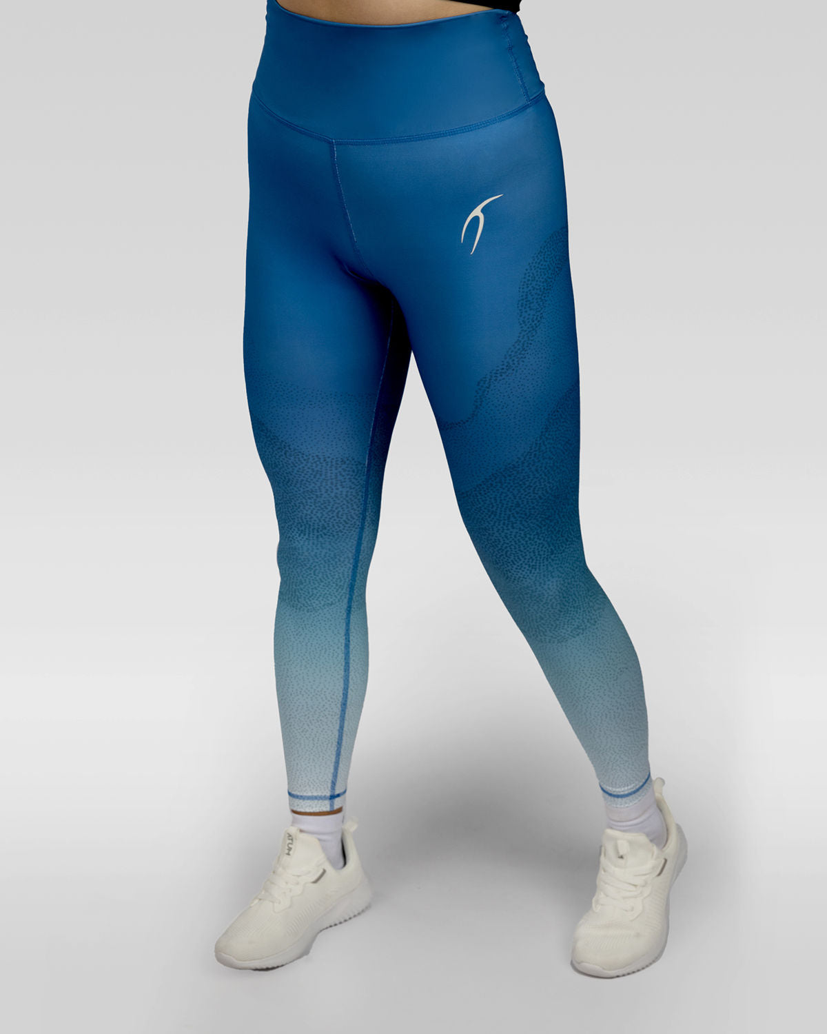 Photo by ð—”ð—§ð—¨ð— SPORTSWEAR Â® on December 20, 2022. May be an image of 1 woman wears blue gradient leggings with white shoes.