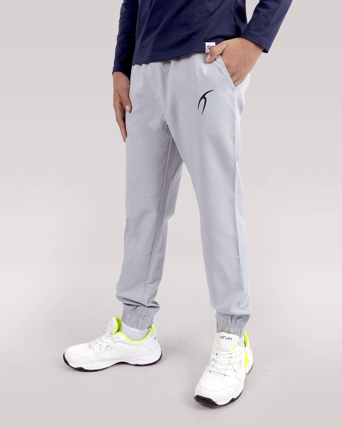 Photo by 𝗔𝗧𝗨𝗠 SPORTSWEAR ® on December 20, 2022. May be an image of 1 boy wears a gray sweatpants and a white shoes.