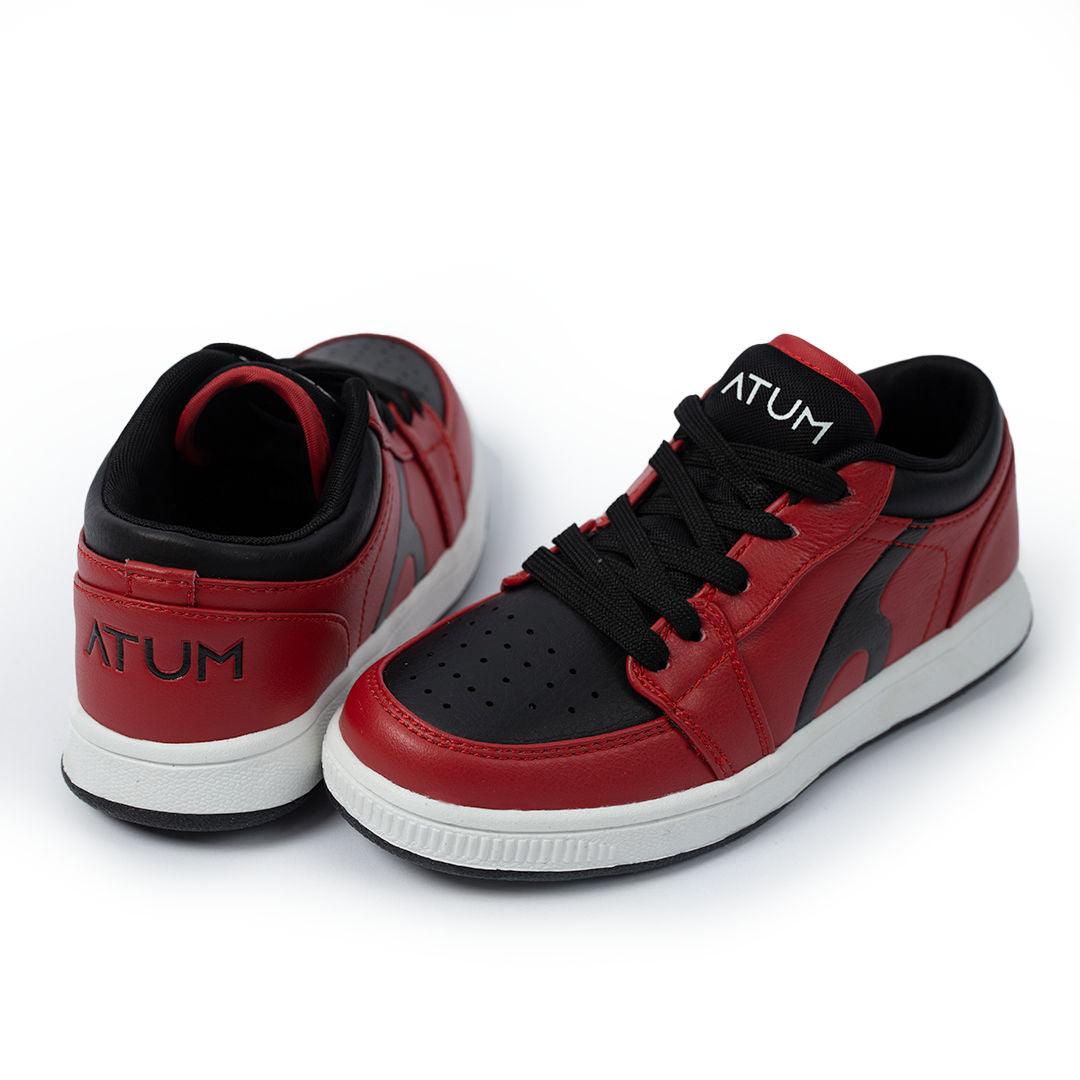 Photo by 𝗔𝗧𝗨𝗠 SPORTSWEAR ® on December 26, 2022. May be of red/black lifestyle shoes with atum logo