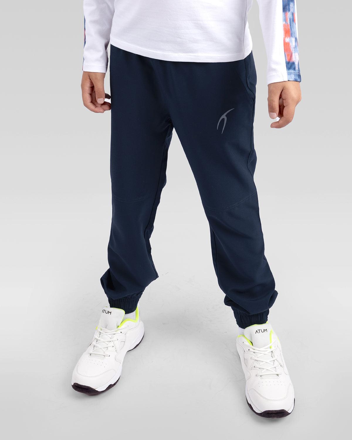 Photo by 𝗔𝗧𝗨ð�— SPORTSWEAR ® on December 20, 2022. May be an image of 1 boy wears a navy sweatpants and a white shoes.