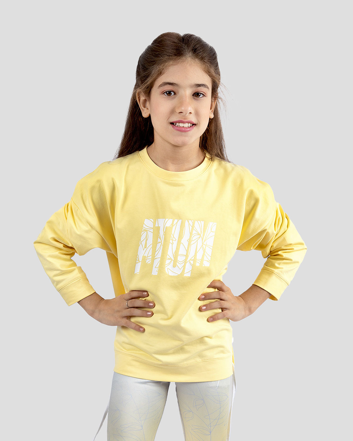 Photo by ð—”ð—§ð—¨ð— SPORTSWEAR Â® on December 20, 2022. May be an image of 1 girl wears yellow sweatshirt.