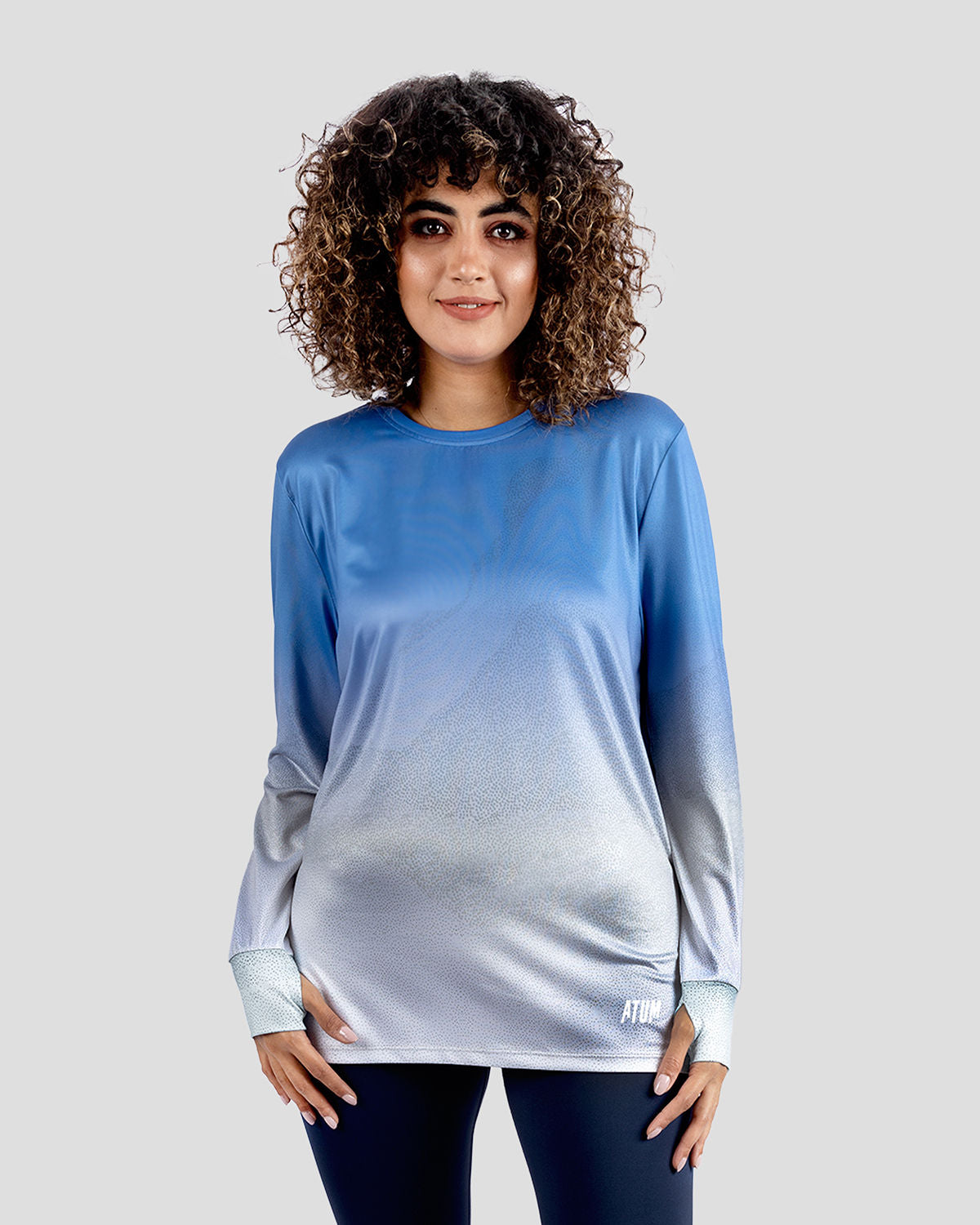 Photo by ð—”ð—§ð—¨ð— SPORTSWEAR Â® on December 20, 2022. May be an image of 1 woman wears blue gradient t-shirt.