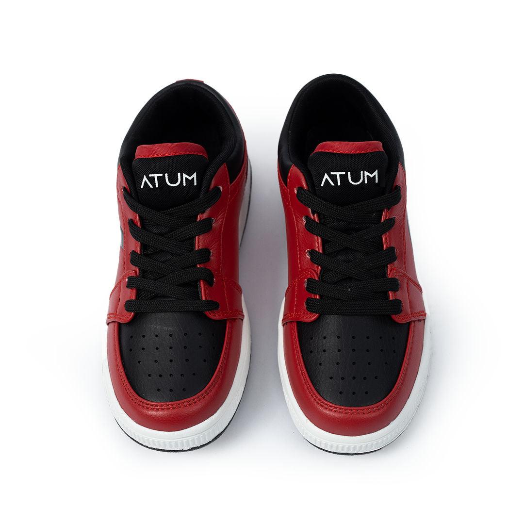 Photo by 𝗔𝗧𝗨ð�— SPORTSWEAR ® on December 26, 2022. May be of red/black lifestyle shoes with atum logo