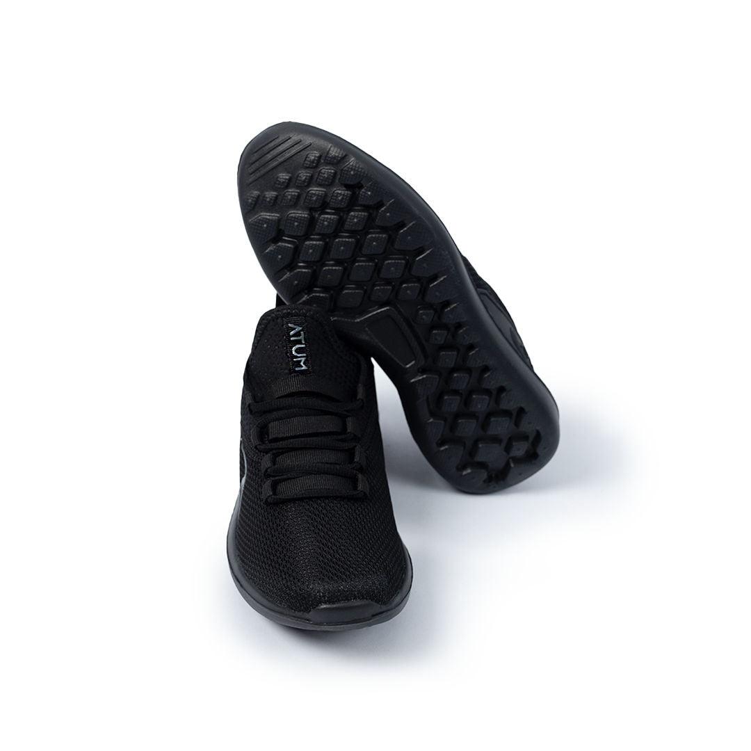Photo by 𝗔𝗧𝗨ð�— SPORTSWEAR ® on December 26, 2022. May be a black unisex training shoes with atum emblem.