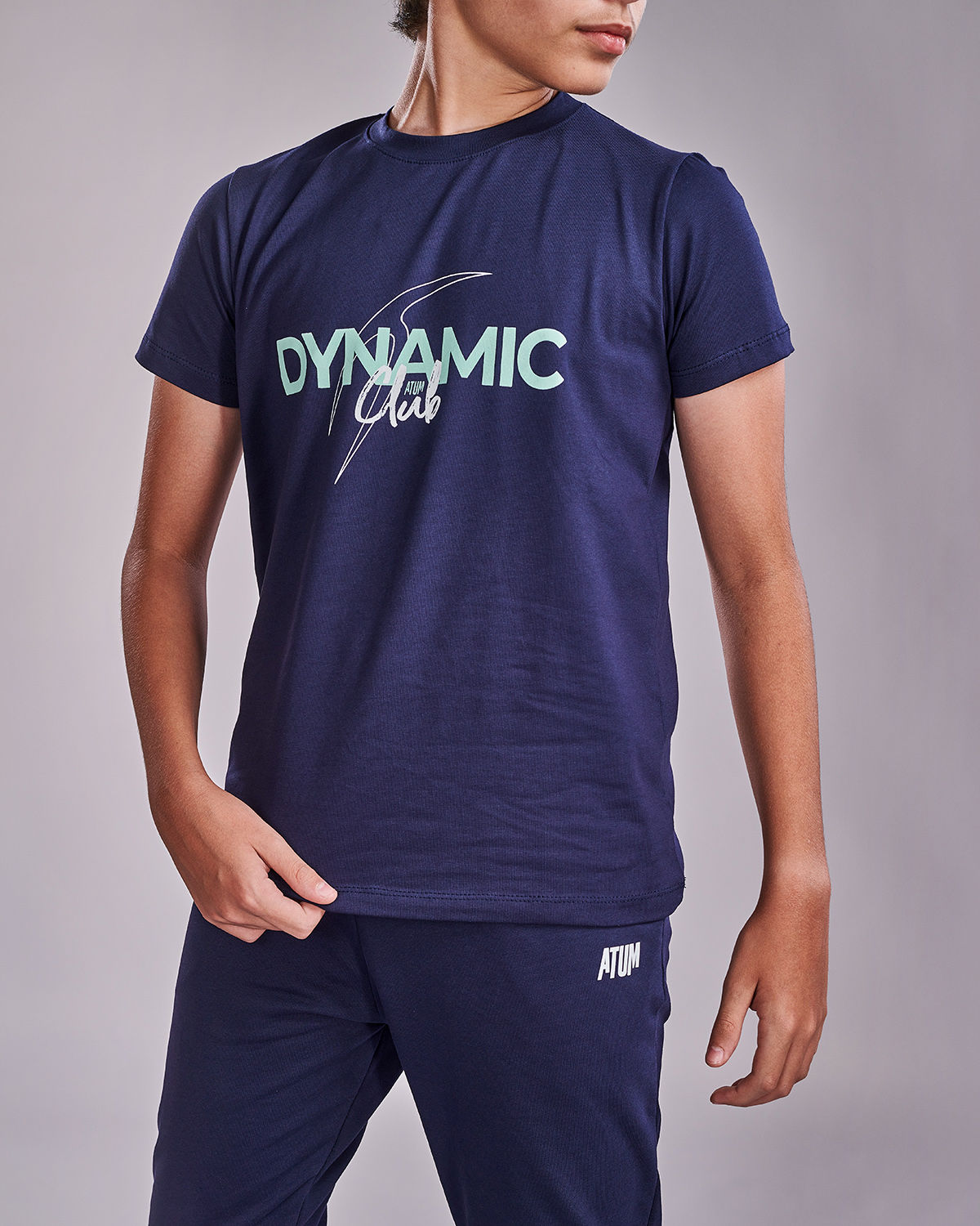 Photo by 𝗔𝗧𝗨𝗠 SPORTSWEAR ® on May 22, 2022. May be an image of 1 boy wears a navy t-shirt with a text ''Dynamic club".
