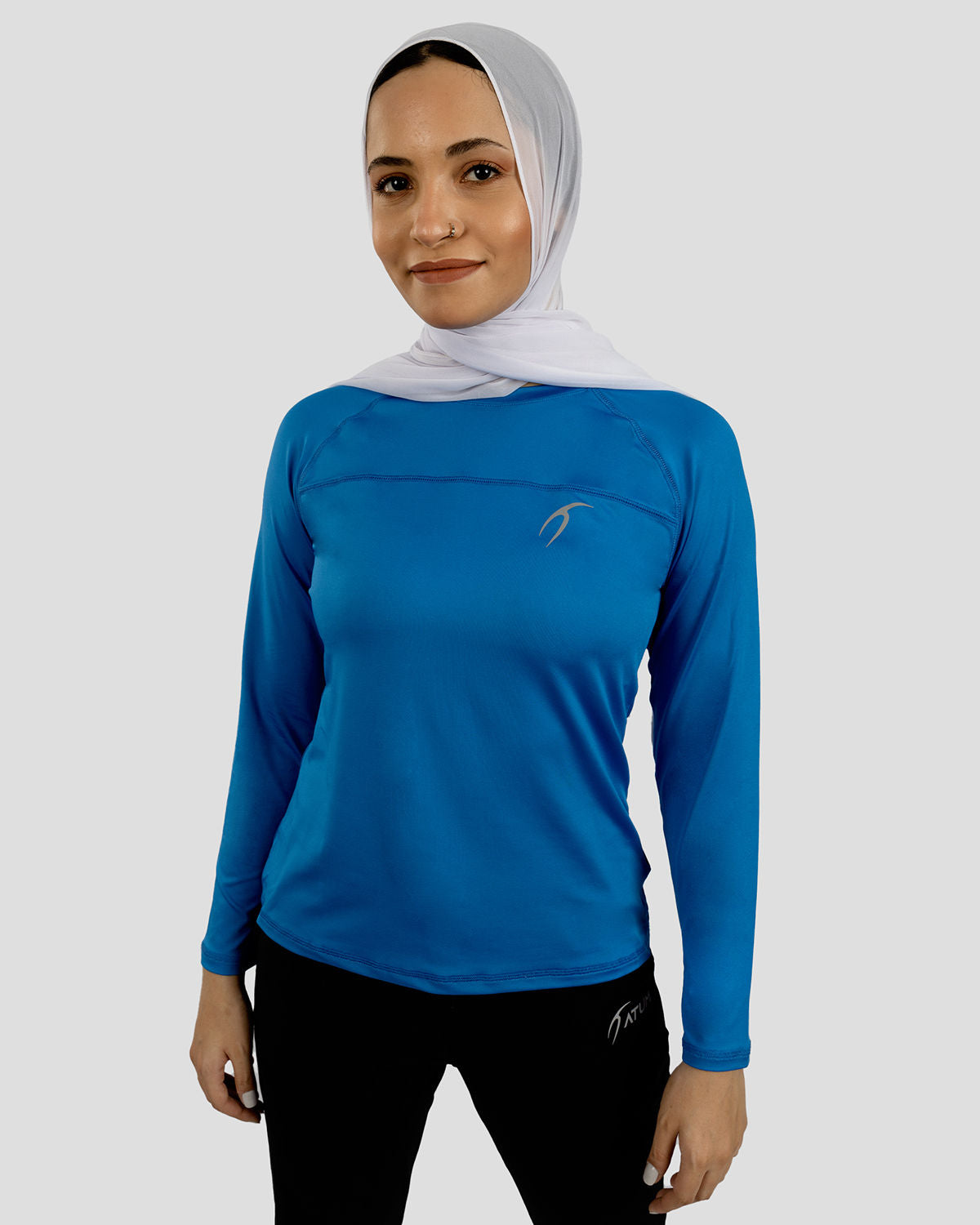 Photo by ð—”ð—§ð—¨ð— SPORTSWEAR Â® on December 20, 2022. May be an image of 1 woman wear blue training t-shirt.
