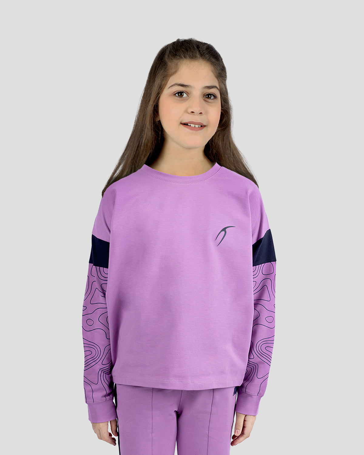Photo by ð—”ð—§ð—¨ð— SPORTSWEAR Â® on December 20, 2022. May be an image of 1 girl wears violet sweatshirt with atum emblem.