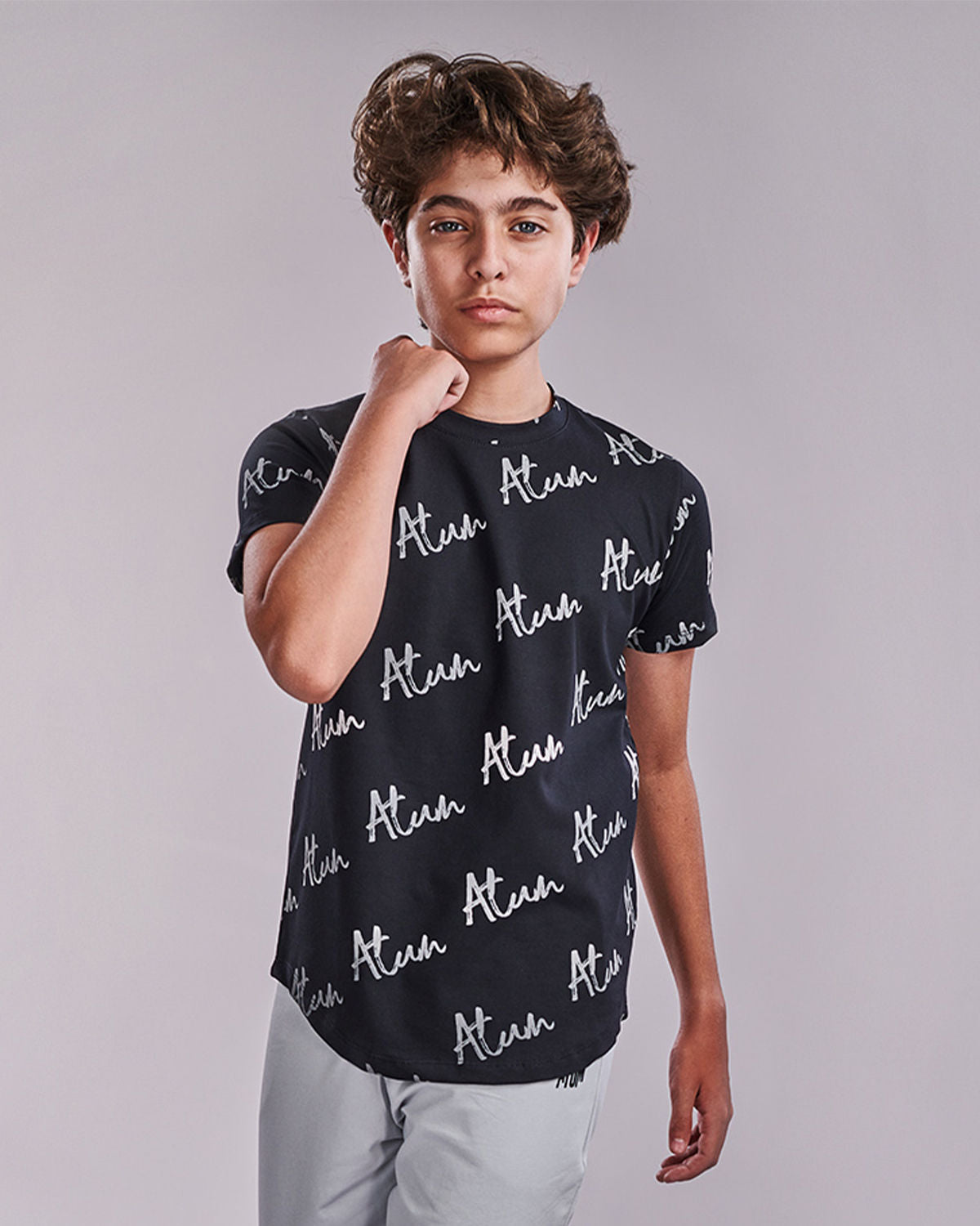 Photo by 𝗔𝗧𝗨𝗠 SPORTSWEAR ® on May 22, 2022. May be an image of 1 boy wears a black printed t-shirt.